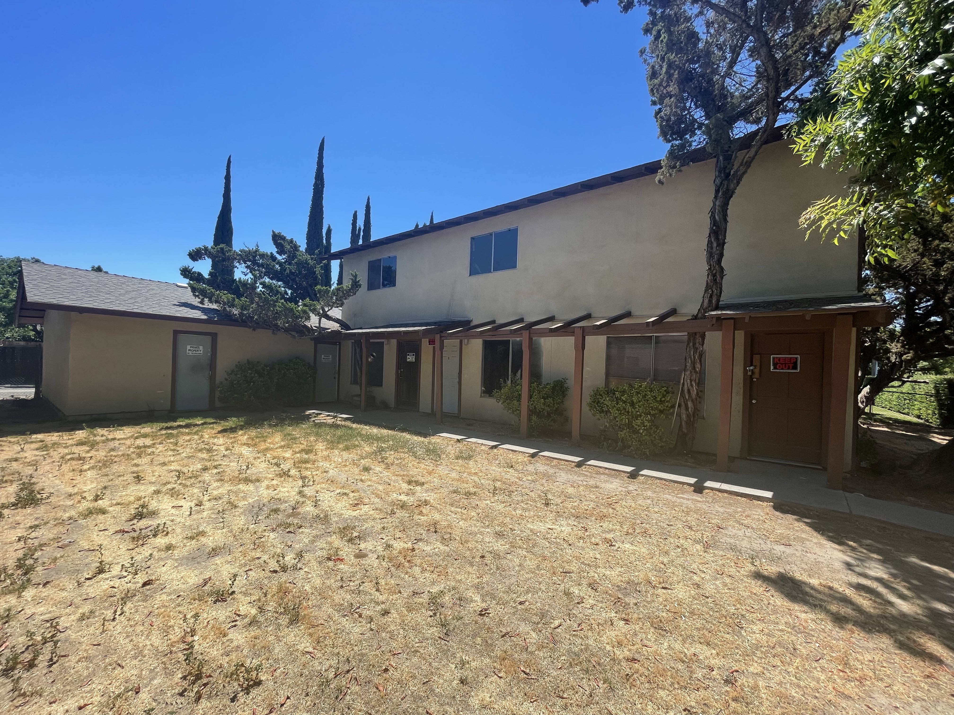 outside View from front yard, Modesto CA. Before Good Life Fire Restoration began renovation Photo