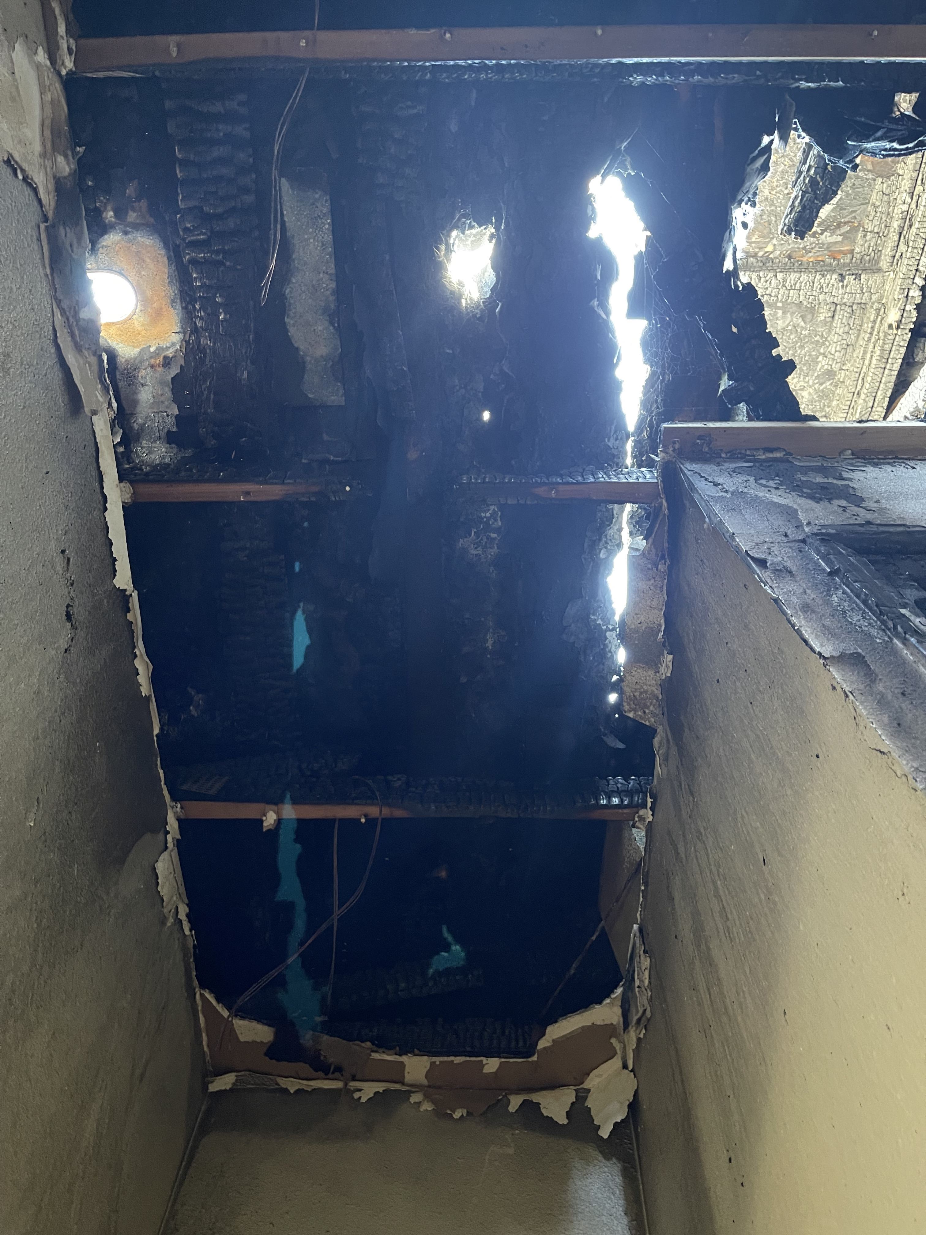 Attic, ceiling, and roof damage from fire Photo