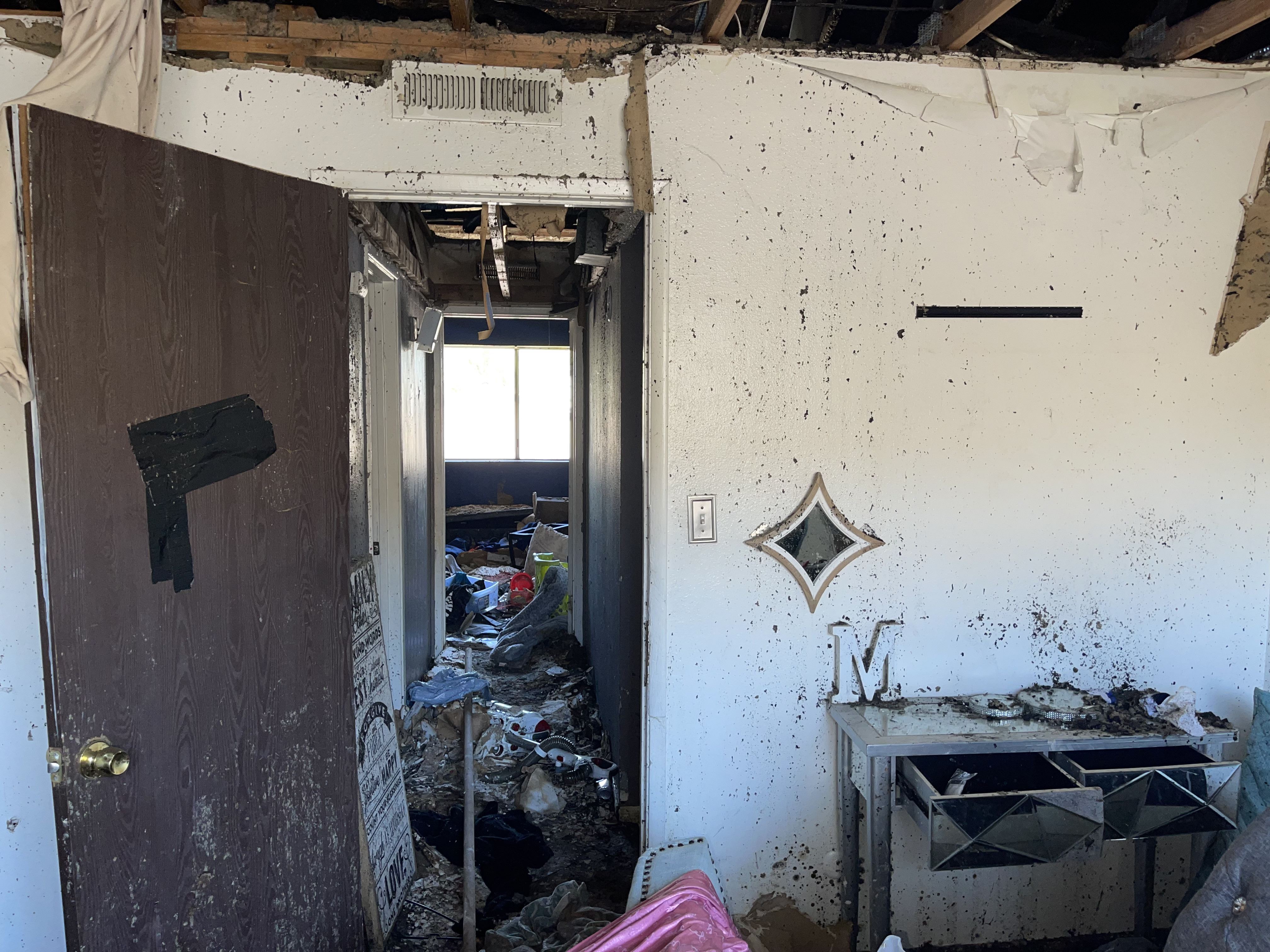 Upstairs view of a 2nd unit, damaged from fire and crews. Before Photo