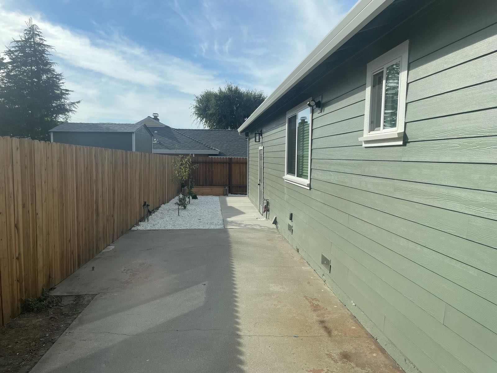 EXTERIOR SIDE VIEW OF GARAGE AFTER RESTORATION Photo