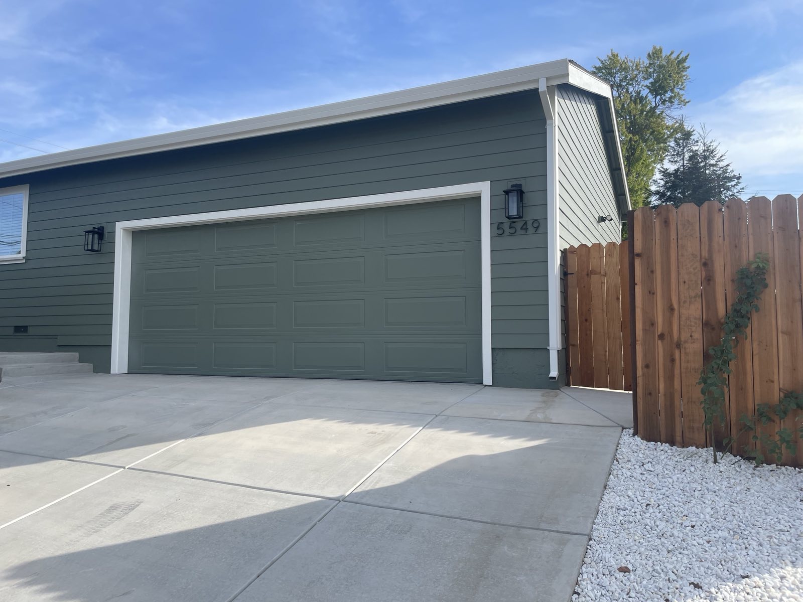 EXTERIOR STREET VIEW AFTER RECONSTRUCITON OF GARAGE DUE TO FIRE DAMAGE Photo