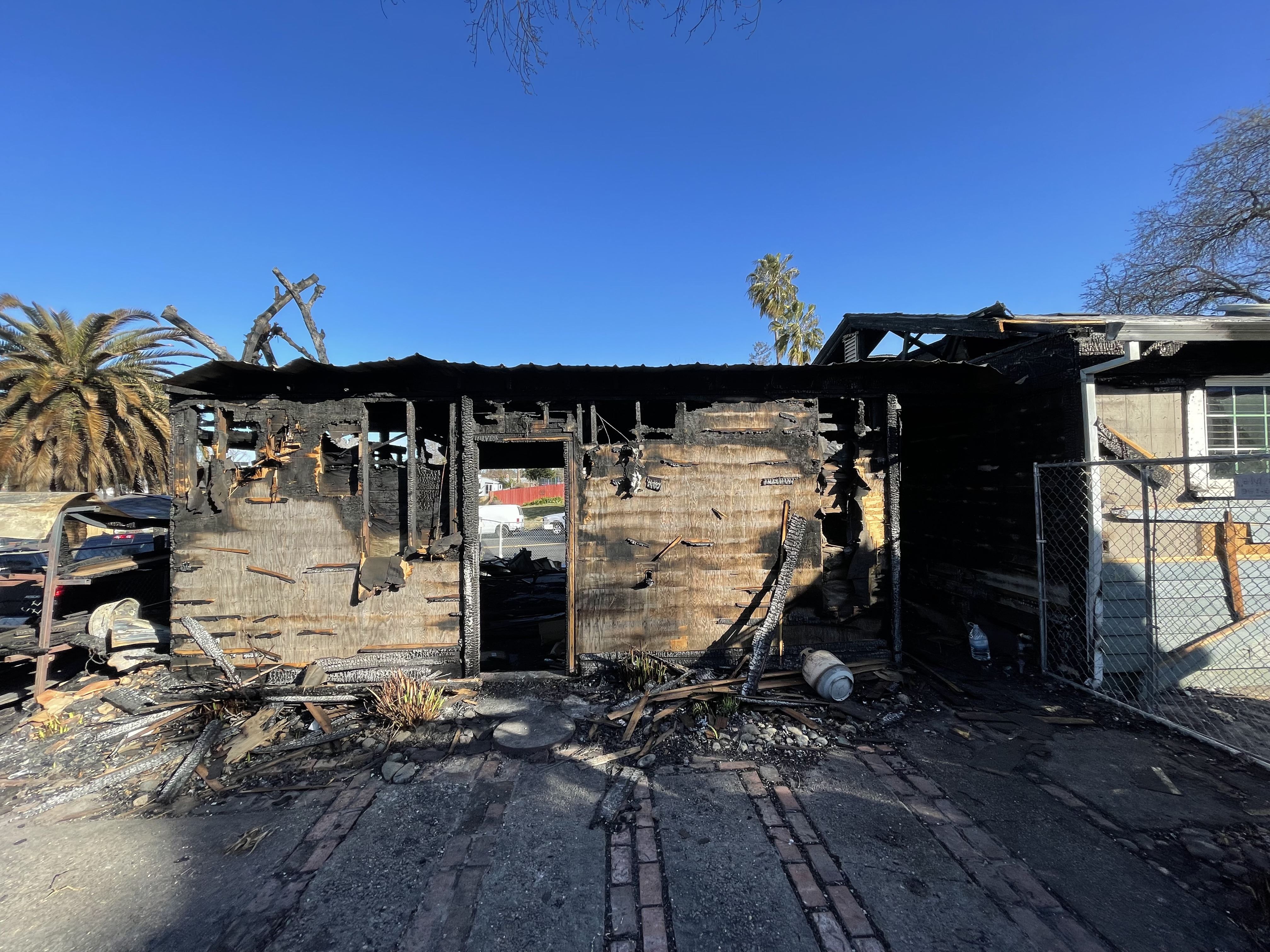 EXTERIOR REAR VIEW, FIRE DAMAGE Photo