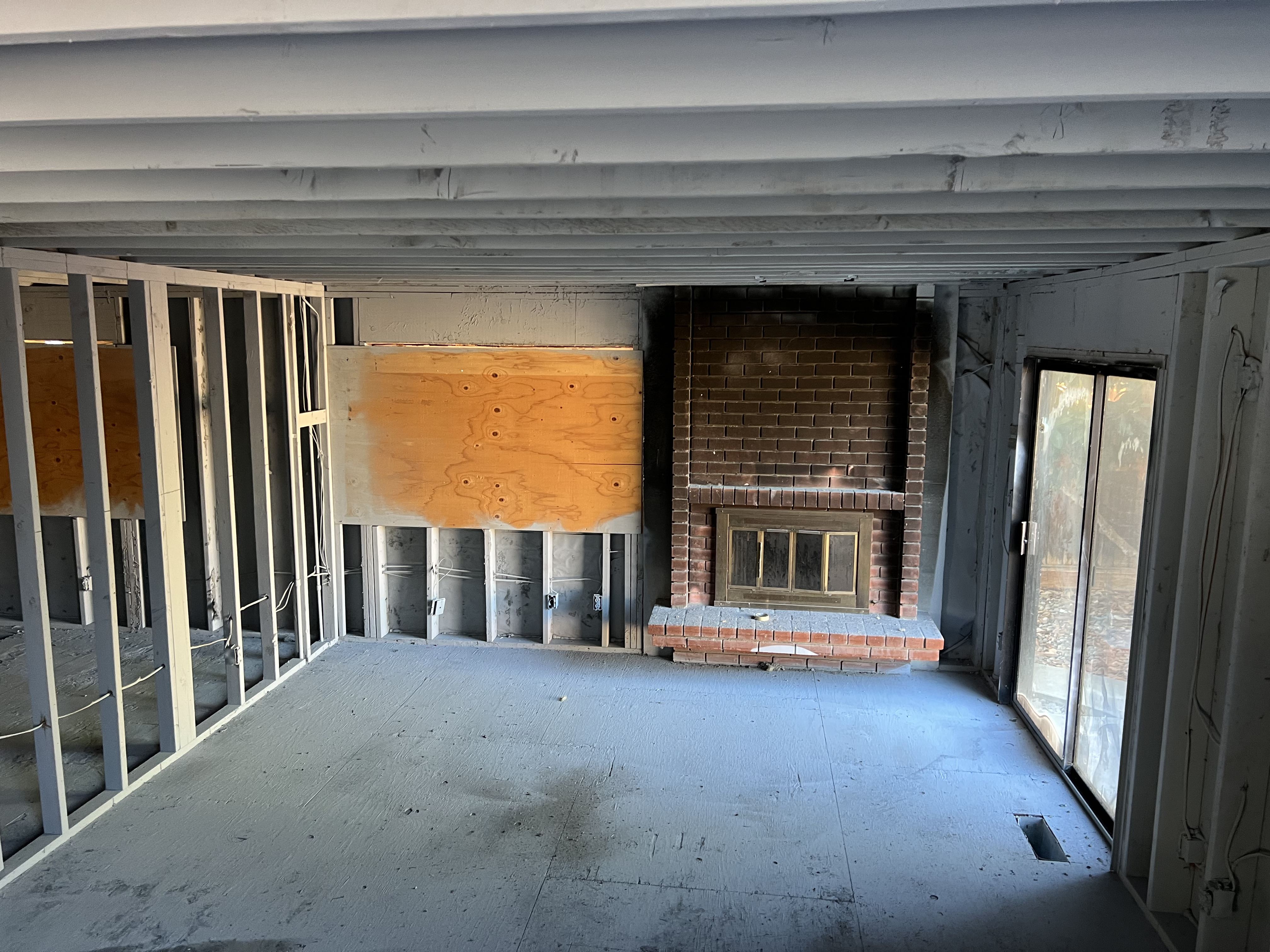 Before: Fireplace and living room gutted and demolition complete Photo