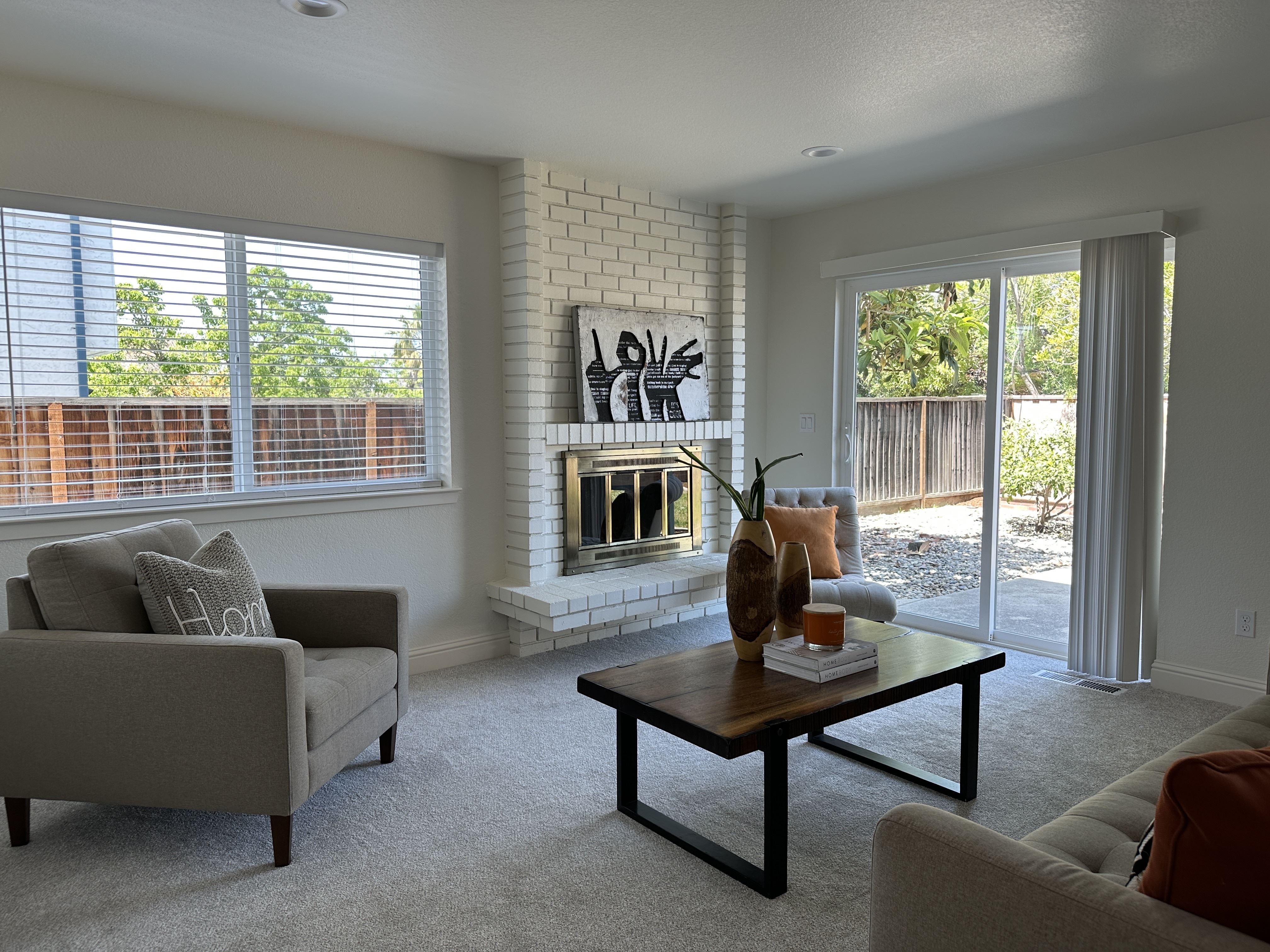 After: The cozy and inviting living room and fire place after restoration. Photo